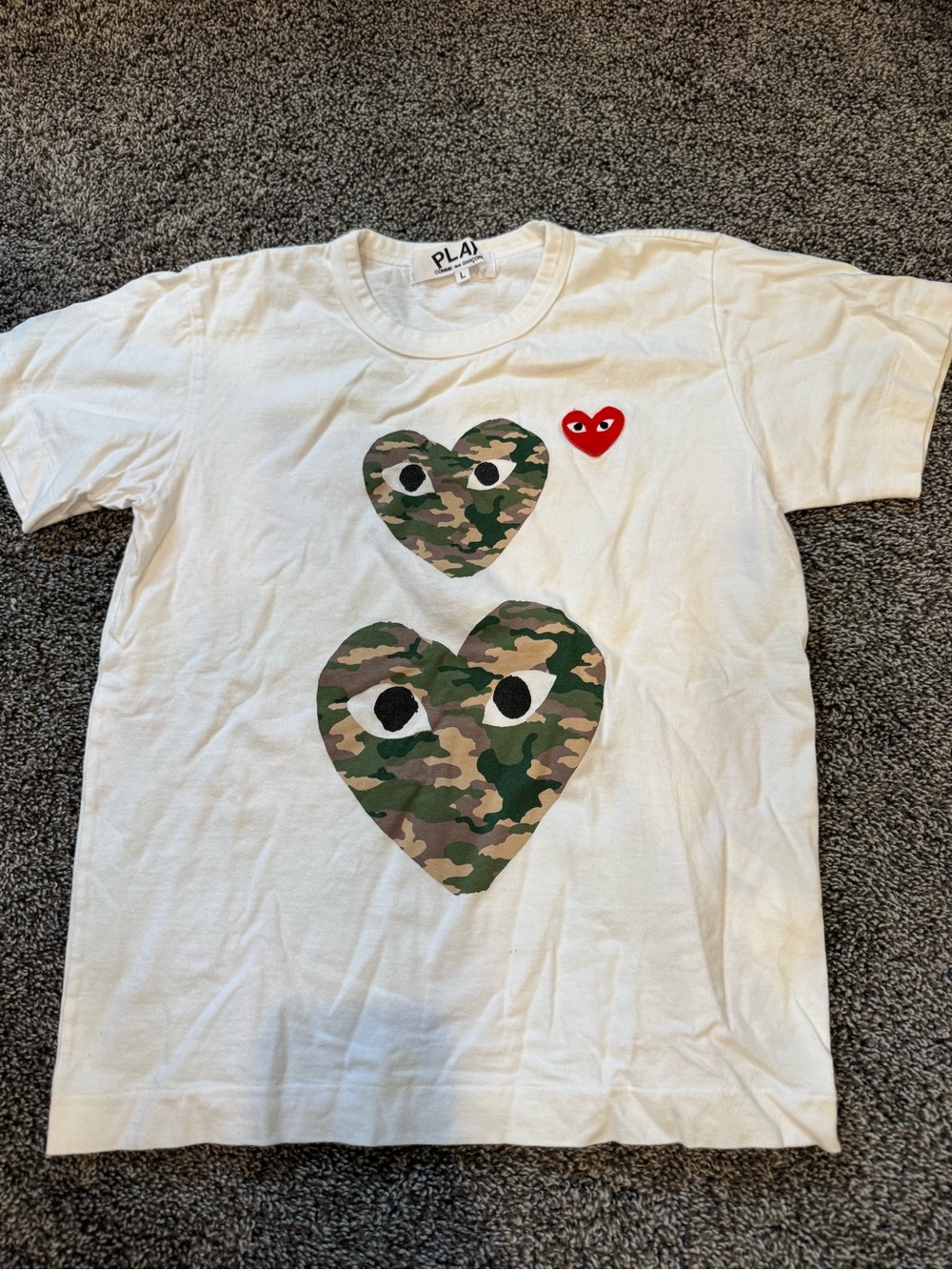 Comme des Garçons Kids White Tee with Camo Heart Graphics and Red PLAY Patch